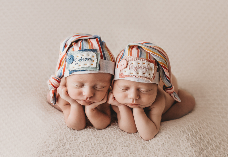 Lawton, Oklahoma photographer, twin newborns asleep with rainbow sleepy caps