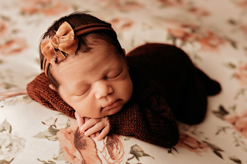 Fort Gregg Adams, Virginia newborn photographer, Fort Lee, Virginia newborn photographer sleeping newborn baby girl in knit outfit with her hands folded underneath her head