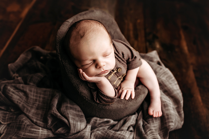 Richmond, Virginia newborn photos, Richmond, Virginia newborn photographer newborn baby wearing brown outfit leaning in baby chair