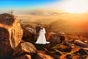 Oklahoma City, Oklahoma maternity photographer, pregnant woman in white boho gown with husband on top of Mount Scott