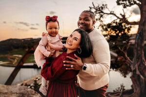 Midlothian, Virginia photographer, family of three lifting youngest black daughter up in the air