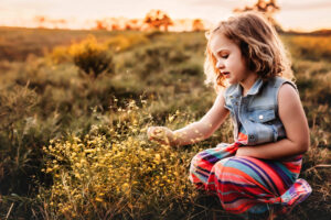lawton Oklahoma photographer, young blonde-haired girl picking yellow flowers
